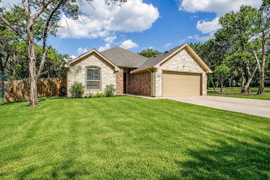 Beautiful home located in the sought-after Fisherman’s Paradise community in Rio Vista, TX! Situated on a very private cul-de-sac and totaling approximately 0.455 acres (3 parcel IDs: 126.4227.01920, 126.4227.01930, 126.4227.01940), this 3-bedroom, 2-bath home offers thoughtfully designed living space with peaceful country surroundings and quick access to Hamm Creek Park and the Brazos River for fishing, boating, and outdoor recreation. Inside you’ll find a wide-open floor plan featuring vaulted ceilings with stunning web truss beams, a fireplace, tile flooring, double-pane vinyl windows, and abundant natural light. The kitchen is both stylish and functional with granite countertops, ample cabinetry, walk-in pantry, and more. The split-bedroom layout provides privacy, with a spacious primary suite offering dual sinks, granite countertops, elegant cabinetry, a garden soaking tub, oversized walk-in shower, and two walk-in closets. Bedrooms 2 and 3 are generously sized with walk-in closets. Exterior features include a concrete front driveway, with 2 car garage, covered front porch, covered back patio, wood-fenced backyard, mature trees, and a beautifully treed green space surrounding the home offering exceptional privacy! The adjacent lots offer additional opportunity and could potentially accommodate another home, providing flexibility for future expansion or investment (buyer to verify). Enjoy peaceful living outside city limits and convenient access to fishing, boating, and nature — a must see! The property includes three parcels totaling approximately 0.455 acres, offering both space and privacy in a truly picturesque setting. Home is located in a quiet cul-de-sac.