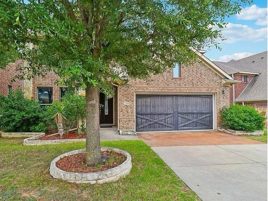 Discover comfort, style, and space in this beautiful two-story brick home nestled in the sought-after Indian Creek, Carrollton neighborhood. This central location has great access to nearby freeways; Sam Rayburn Tollway, I-35 East and Pres. George Bush Tollway. Built in 2012, this home offers 4 bedrooms, 2.5 baths, an office with french doors, a media room and two spacious living areas, and a 2-car garage, all thoughtfully designed for modern family living, with great living space on both floors. The inviting open-concept layout that connects the living, dining, and kitchen areas is ideal for entertaining and everyday life. Natural light fills the home, highlighting its warm wood finishes and effortless flow. Storage is abundant throughout, with generous closets in every bedroom and a large walk-in closet in the main level primary suite that connects to the laundry room.
Upstairs features generously sized secondary bedrooms, and a well-appointed bathroom, providing flexible space for family or guests, as well as a large family room and media room, that is perfect for family movie nights. 
Outside, the brick exterior and welcoming curb appeal set the tone for a home that has been truly cared for. The large backyard is encompassed by a wooden privacy fence, covered patio, and an extended patio that is ideal for barbeques. 1009 Chickasaw is zoned to LISD- Hebron High School and is located around the corner from the highly rated Coyote Ridge Elementary, making school pick-up and drop off quick and convenient. A beautiful place to call home– ready for its next family. Don't miss this gem! Home is virtually staged.