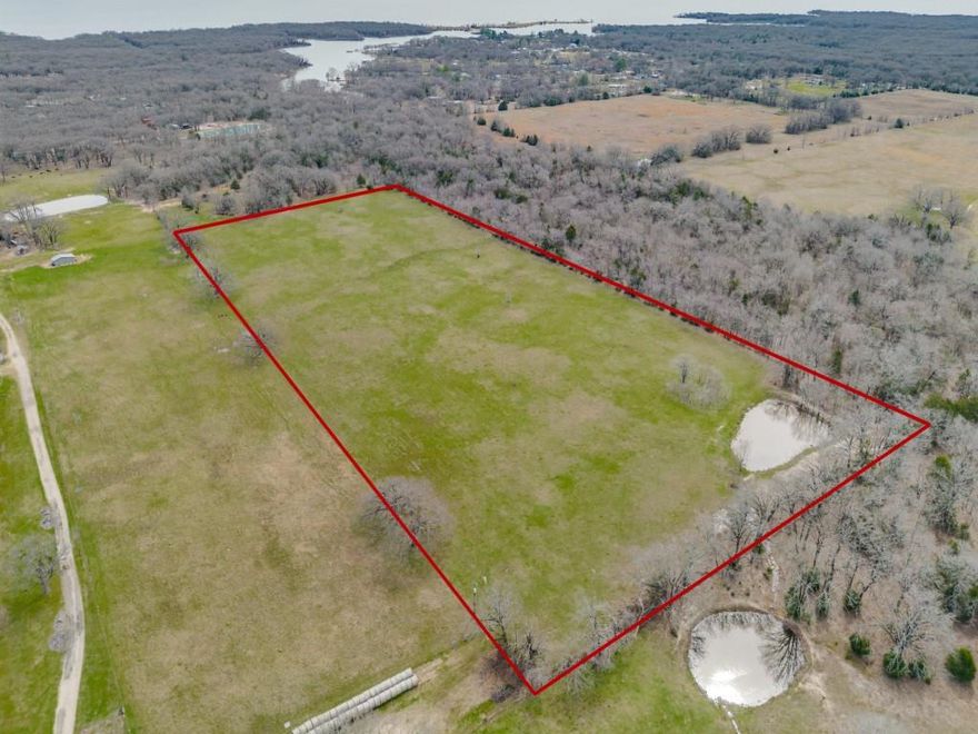 A truly beautiful TREE-LINED piece of property! 14 ACRES perfect for a country dream home or divide into multiple home sites. Possibilities abound! It's adjacent on the south end and east end to the Sabine River Authority, so no one will ever build on those sides. Fully fenced with barbwire, with a STOCK TANK-POND on the SW corner. Water & electric are available. Property is exempt for native pasture-grass. Very close to the Lake Tawakoni two mile bridge.