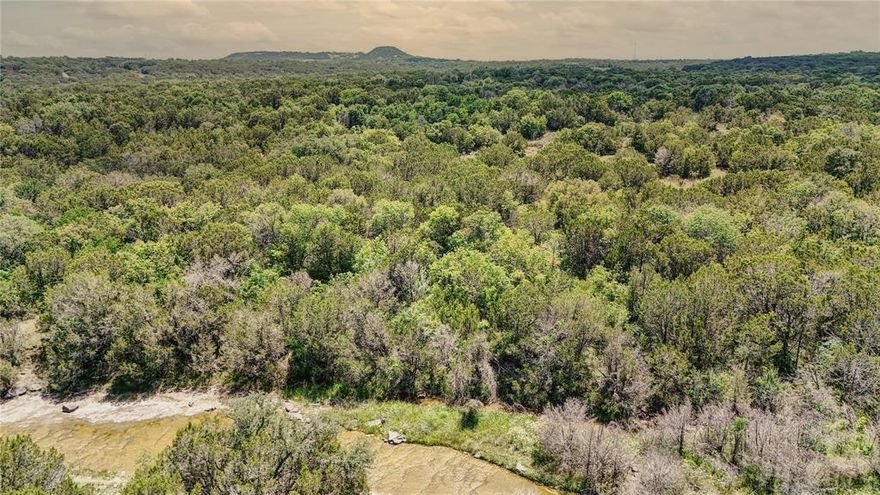Rare find! Completely untouched and clean land. No easements or zoning in place. Coop Water and Electricity already in place on both sides of the property.

Discover an exceptional opportunity to own a stunning 105-acre parcel of land right outside the Granbury city limits. This expansive property features varied terrain and topography, offering a perfect blend of natural beauty and practical utility.

The land boasts a mix of wooded areas and cleared spaces, catering to various uses and providing breathtaking vistas. A picturesque creek runs the entire northern perimeter of the property, enhancing the natural charm of the landscape and providing a barrier from others. Whether you envision a hunting retreat, a thriving ranch, or a new housing development, this property offers unlimited potential to bring your vision to life.