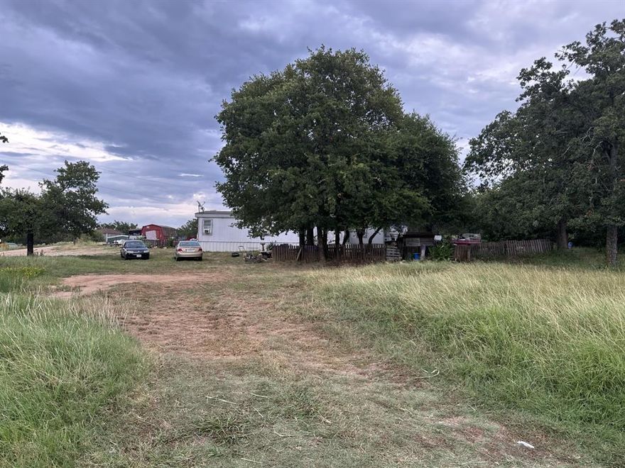 Great investment opportunity! Over 3 acres with two mobile homes on the property. Lots of trees. Great location in Springtown.