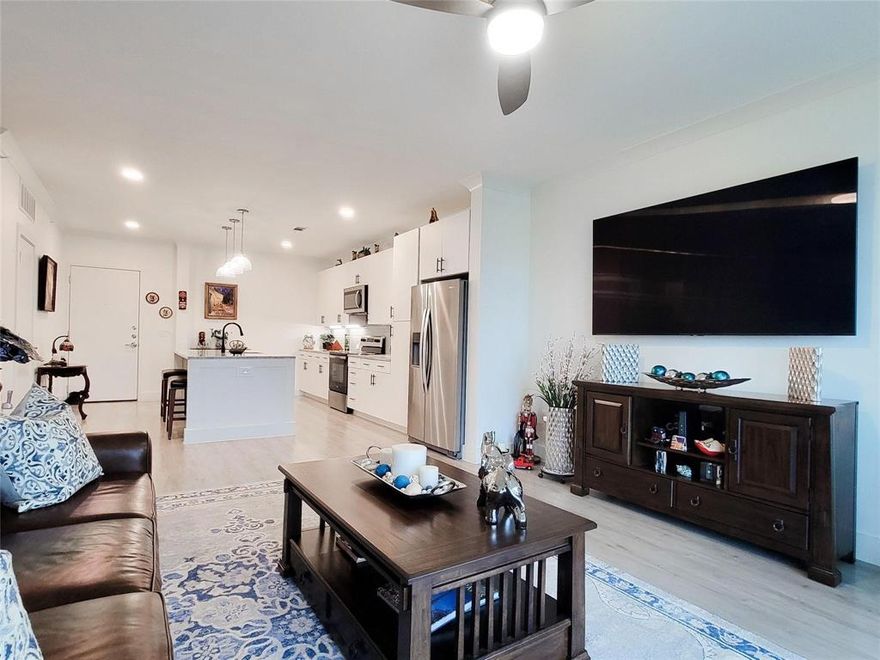 This property includes storage, garage, fridge, washer, dryer and giant TV! Experience luxury living at Sojourn at The Realm in the sought-after Castle Hills community! This beautifully appointed 1-bedroom, 1-bath condo offers thoughtfully designed living space with upscale finishes throughout. The open-concept floor plan is flooded with natural light and features luxury vinyl plank flooring in the main living areas and plush carpeting in the bedroom.

The gourmet kitchen impresses with granite countertops, a subway tile backsplash, stainless steel appliances, designer pendant lighting, and a generous island with seating, perfect for everyday living and entertaining. The spacious primary suite includes a large walk-in closet with washer and dryer hookups for added convenience. The spa-inspired bathroom features dual sinks, granite counters, and a walk-in shower.

Step out to your private covered balcony and enjoy peaceful views of the community. Additional highlights include one garage parking space, one covered parking spot, a private storage unit, valet doorstep trash service, and a secure camera-monitored lobby. HOA covers front yard maintenance, grounds upkeep, pest control, and trash service.

Ideally located just south of the Sam Rayburn Tollway at Windhaven and Castle Hills Drive, minutes from Grandscape, The Realm shopping and dining, and with quick access to SH-121, I-35, and the George Bush Turnpike. DFW International Airport is approximately 20 minutes away. Zoned to Lewisville ISD. Low-maintenance living at its finest, do not miss this one!