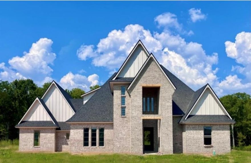 Brand New Construction – Move In Just in Time for the Holidays!
This thoughtfully designed home will be ready in time for you to open presents Christmas morning! Step into a welcoming entryway that flows into a spacious family room featuring soaring ceilings and large picture windows that overlook the peaceful, covered back patio—perfect for relaxing or entertaining. The kitchen is a showstopper with a flat-top island offering bar seating, abundant cabinet space, a walk-in pantry, and a convenient half bath nearby. The remote master suite is a true retreat with a garden tub, walk-in shower, and a generously sized closet that connects directly to the laundry room for maximum convenience. A guest bedroom and full bath are located downstairs, while upstairs offers two additional bedrooms, a full bath, and a versatile landing area—great for a playroom, office, or second living space.  And the best part? There's still time to make it your own—choose your flooring, fixtures, and countertops to match your style!  Don't miss this rare opportunity to own a brand-new home with custom touches, just in time for the holidays.