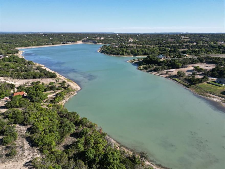 **Discover Your Dream Retreat in Bluff Dale, TX!**

Unveil the potential of this stunning treed corner lot, perfectly situated between Stephenville and Granbury. Experience serene lake views and an idyllic lifestyle in a quiet neighborhood that offers the best of both convenience and tranquility. 

This spacious lot features level terrain with gentle elevation changes, making it an ideal canvas for your future home. Utilities including electricity, fiber internet and water are readily available at the road.

Enjoy easy access to the community’s array of amenities, including two private lakes, a clubhouse, a sparkling community pool, a play park, walking trails, and a community boat dock. Plus, RV parking and storage options are available for your outdoor adventures.

With convenient ingress and egress from FM2481 and CR 172, you’re just minutes away from downtown Bluff Dale and within reach of DFW, Granbury, Weatherford, Tolar, Glen Rose, and Stephenville. 

Don’t miss this opportunity to build your ideal retreat in Mountain Lakes—where nature meets community living! Act now and make this slice of paradise your own!
