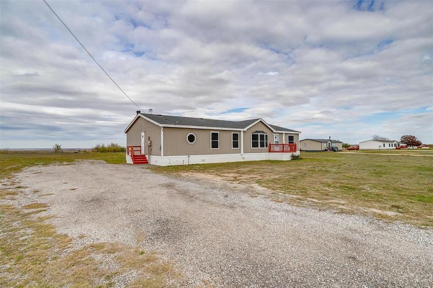 If country living and pretty hilltop views are your thing, then this one is worth taking a look at!  It just went through a remodel with new paint inside and out along with new flooring.  Nice custom decks at both entrances, white cabinets and new counter tops in the kitchen.  Split bedroom floor plan.  Make an appointment to see this gem today!