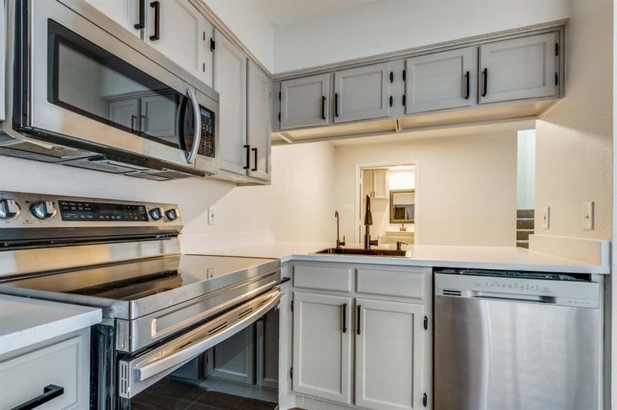 Completely remodeled in 2026 – Move-in ready townhome-style condo in the heart of Arlington’s vibrant Entertainment District!

Discover modern luxury and low-maintenance living at Wellington Place I, just minutes from AT&T Stadium, Globe Life Field, Texas Live!, River Legacy Park, and easy I-30 access. Perfectly positioned for entertainment, dining, and commuting.
This stunning, freshly updated unit boasts a brand-new HVAC system 2026, luxurious new carpet, sleek quartz countertops, contemporary fixtures, and crisp neutral paint throughout—delivering a bright, turnkey feel with all major systems upgraded for peace of mind.

Inviting Living Room with cozy fireplace and abundant natural light, flowing through elegant double French doors to your private patio for effortless indoor-outdoor entertaining.
Functional Kitchen with seamless pass-through to dining, direct patio access, and smart layout ideal for daily meals or hosting guests.
Convenient downstairs half bath complete with washer and dryer connections.
Spacious upstairs featuring an oversized primary bedroom with generous walk-in closet, a second bedroom, and extra linen storage.
Added perks: Private exterior storage closet off the patio.

Enjoy resort-style amenities with HOA covering exterior maintenance, roof replacement, landscaping, building insurance, sparkling pool, clubhouse, assigned covered parking, and guest spots—true low-maintenance lifestyle.
Whether you're an owner-occupant seeking move-in perfection or an investor eyeing a fully upgraded gem in a prime location, this home delivers exceptional value near major employment hubs and endless entertainment.