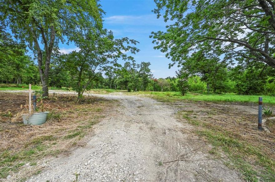 Discover the perfect blend of open space and natural beauty on this 1.64-Acre Lot, just 0.8 miles from Lake Texoma. With a mix of cleared areas, mature trees and its very own pond, this property offers a versatile canvas to build your vision while keeping plenty of privacy! Outside the city limits with no HOA, take advantage of a 1.6% tax rate! It provides flexibility and freedom rarely found. Utilities are ready for easy connection with water and electricity available. The only restriction is a 5-foot setback for utilities, making this property ideal for those looking to create their own retreat near the lake. Whether for a primary residence, a weekend getaway, or an investment opportunity, this lot combines the best of nature and convenience an a sought-after location. You can have this 1 lot or all 3 (Please see TBD Hillcrest Cir MLS# 20985734  and TBD George A. Green Dr MLS# 20986872  for reference) and have nearly 5acres of land all to your own in a packed deal!!