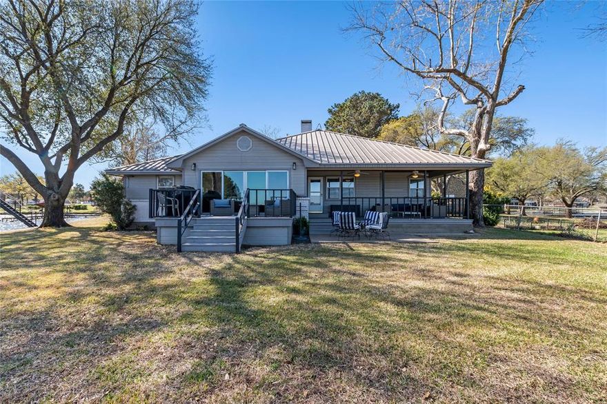 One of a kind Lake House that was completely remodeled in 2023.  The house is listed as TURNKEY, so EVERYTHING stays. The house sits on a point with over 253 feet of waterfront overlooking one of the most beautiful wide coves on Cedar Creek Lake.  Good deep water with wide open water views. The large open floor plan overlooks the big backyard and lake.  Plenty of parking and garage storage as well with a workshop. Next to that is an RV pad with hookups.  The boat dock has plenty of room for a boat and 2 jet skis with more amazing lake views from the top deck.   Location, your very own point of land on water, with views for miles.  This property is a MUST SEE.  All you need to do is bring your swimsuits.
