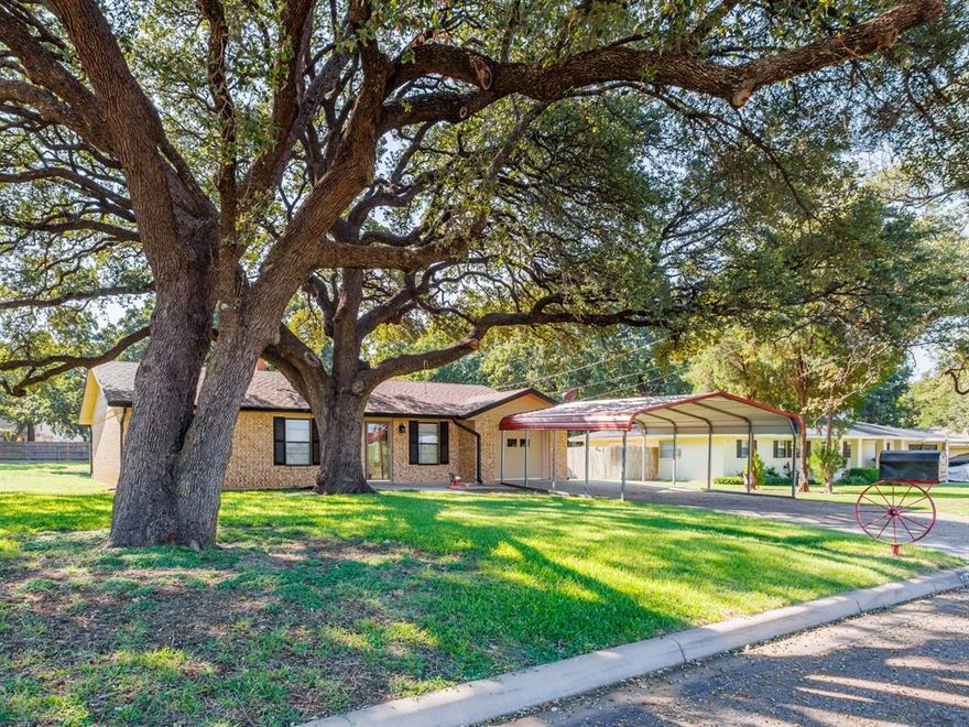 Resting beneath majestic oak trees, you will find this delightful 3 bedroom, 1 bath home boasting two spacious living areas, in the highly regarded Early School District. A one-car garage, thoughtfully paneled, insulated plus a mini-spit turns laundry into a breeze.  The front entry two-car garage offers shelter for your vehicles, while the expansive backyard features a convenient storage building with a concrete walkway leading to the back porch.  The bath has been cleverly converted from a one and a half bath to a single, with the original plumbing still intact.  The primary bedroom offers a walk-in closet.  Step onto the large covered back porch, creating an ideal space for outdoor dining and entertaining, ensuring a lifestyle of comfort and enjoyment.  Refrigerator does convey on request.