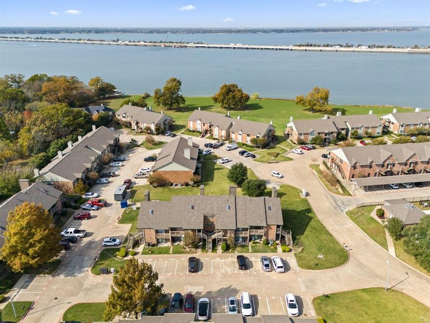 Gorgeous 2nd Floor Corner Unit With Stunning Lake Views + Tons of Updates!
This beautifully updated Signal Ridge condo sits in one of the community’s most desirable locations—a private corner unit with panoramic views of Lake Ray Hubbard. Enjoy resort-style living with 2 pools, a basketball court, lush greenspace, and low HOA fees. This could be a rental property for an investor, a fantastic option for a weekend retreat, or full-time home. Step inside to a bright, airy living room featuring tall ceilings, abundant natural light, a cozy fireplace, and an oversized private deck perfect for taking in Lake Ray Hubbard’s sunsets. The updated kitchen boasts granite countertops, a new dishwasher, new sink, new garbage disposal, and a walk-in pantry, with a dining area surrounded by windows.
The main bedroom offers vaulted ceilings, a private balcony, and a fully updated ensuite bath with dual sinks, a large shower, utility room, and spacious walk-in closet. A loft-style second bedroom sits upstairs past the circular staircase and includes its own remodeled ensuite bath, skylights, and a must-see oversized closet. Recent improvements include a new roof, updated flooring, new blackout window treatments to help save on electricity bills, and a freshly painted deck. Two assigned parking spaces are included for added convenience. The split-bedroom layout provides exceptional privacy, with each bedroom offering its own full bath and balcony access ideal for morning coffee or quiet evenings outdoors. All of this is just steps from The Harbor in Rockwall, featuring top dining, shopping, and entertainment options like Gloria’s, Sideways BBQ, and Giovanni. With immediate access to I-30, commuting to Dallas and surrounding areas is effortless. Whether you're looking for a primary residence, a low-maintenance lock-and-leave lifestyle, or an investment opportunity, this condo checks every box. Experience lakefront living with unmatched urban convenience live where others vacation.