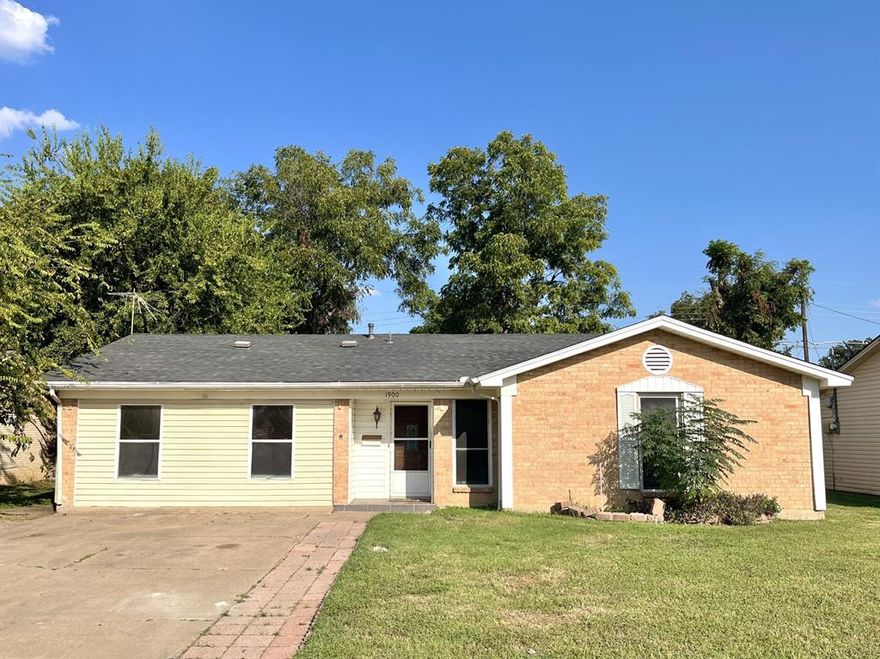 SIX bedrooms in a great DFW location! Wow! The primary house is 1,906 sq ft and includes 5 bedrooms with a converted garage, and the detached 345 sq ft auxiliary building has a living area, kitchenette, bedroom, and full bath. The auxiliary building has it's own gate for private access. This home is perfect for a large or multi-generational family. You'll love the large dining room and the versatile spacious family room with a corner fireplace. Add your personal finishes to make this property truly shine! This home was appraised at $350,000 in April 2025, and it has been priced to move quickly!