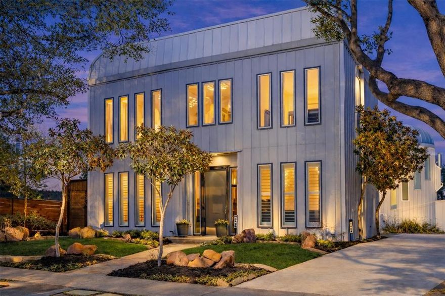 A truly unique contemporary offering with one-of-a-kind design, this two-story residence lives like a single-family home with minimal shared wall and exceptional privacy. As the front unit in an intimate two-home development, it showcases a striking all-metal exterior and beautifully curated finishes throughout, including oak hardwood floors and an airy open-concept layout. The kitchen features sleek maple cabinetry and stainless steel appliances, seamlessly flowing into the main living space anchored by a fireplace. A modern pipe-and-cable stair rail leads to a versatile second-floor bonus room ideal for a home office, nursery, or fitness space. All three bedrooms are private suites, each with walk-in closets, creating a true retreat for every occupant. Outdoor living shines with a front yard, side yard, and screened porch—perfect for relaxing or entertaining. The spa-inspired primary bath offers a freestanding soaking tub, separate shower, and dual sinks, complemented by a stylish powder bath with custom wallpaper. Additional highlights include a two-car attached garage and no HOA fees—completing this extraordinary living experience.