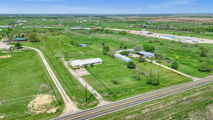 This promising 4.9-acre investment property is located on North Louisiana Street, just outside of Celina. It features a high elevation point that offers panoramic views of the surrounding countryside. The land is flood-free and designated for future industrial commerce use. Additionally, there is a residence on the property that could serve as an excellent office space. Conveniently situated on the edge of Downtown Celina, this property is currently outside the city limits, with the possibility of acquiring additional acreage.