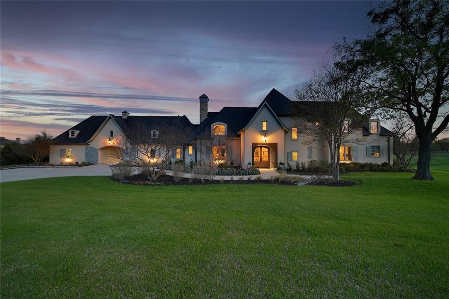 FEATURED IN CANDY'S DIRT, text agent for article, and a CADILLAC commercial! This Country French-inspired estate blends sophistication with modern luxury, nestled on 2 acres of picturesque land adjacent to 4-acres of protected land, providing a RARE privacy opportunity. This exceptional, truly once-in-a-lifetime home features custom windows and finishes throughout, blending timeless elegance with modern functionality. The property backs to a serene pond with a gently lit fountain and rolling hills, providing a peaceful, natural setting for relaxation and entertaining. Situated in the prestigious Lovejoy School District, this home offers access to top-rated schools while being conveniently located minutes away from Dallas' best shopping, entertainment, and dining options. The estate sits on the historic and well-known Blondy Jhune Road, a beloved street in the local community, where neighbors enjoy a close-knit and friendly atmosphere. Whether you're enjoying sunset views by the fire or entertaining guests in your beautifully designed spaces, this property offers the perfect blend of luxury, comfort, and location. Enjoy the tranquility and privacy of rural living with the convenience of city amenities with The Village at Allen, Whole Foods, Top Golf and many restaurants within a few miles and Lovejoy high school is about 2 miles. See transactions desk for a list of custom features.