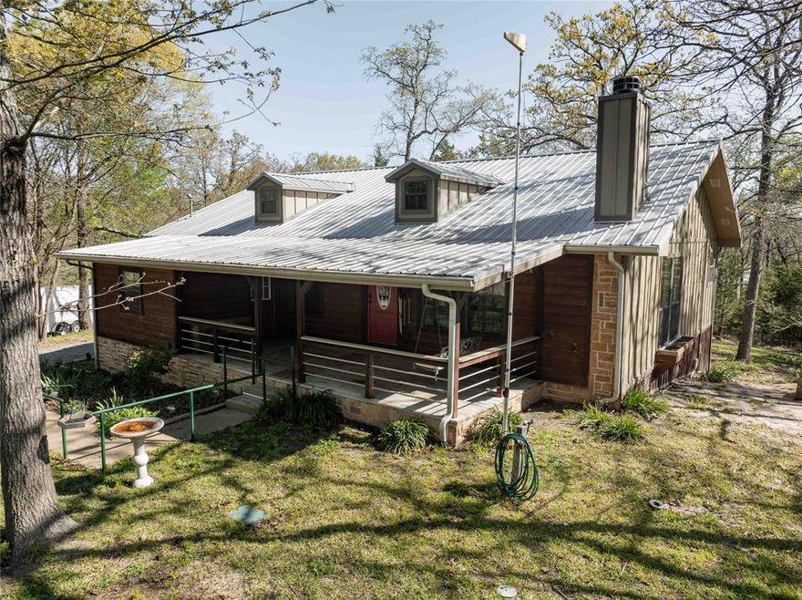 HILLTOP HAVEN WITH STUDIO AND STUNNING LAKE VIEW!!!  Discover your private retreat in the scenic Callender Lake community!  Perched on a quiet hill with panoramic lake views, this charming property consists of three combined lots totaling 0.87 acres, offering unparalleled privacy and space.
The main home offers 1408 sq. feet of comfortable living space with a wood burning fireplace, designed to embrace the serene surroundings. The unique highlight of this property is the separate 20x16  foot studio that is perfect for an art studio, home office, workshop, or guest space.  This home has 3 bedrooms and 2 full baths with open concept living. It has a large covered front porch of 23x10 and a back covered porch of 24x12.  There is also a double garage that is 23x27 for your vehicles and lake toys. 
 The property is located in the gated community of Callender Lake .  The lake is spring fed and has 365 acres that are great for fishing, swimming, and boating.  Community has a boat ramp, fishing pier, children's park, lake swim area, picnic tables and so much more for your enjoyment.  Call your realtor today and get more information on this property and schedule a visit today.  You will not be disappointed with what it has to offer.  The community is Located about 90-120  minutes from the DFW area and 30 minutes from Tyler.