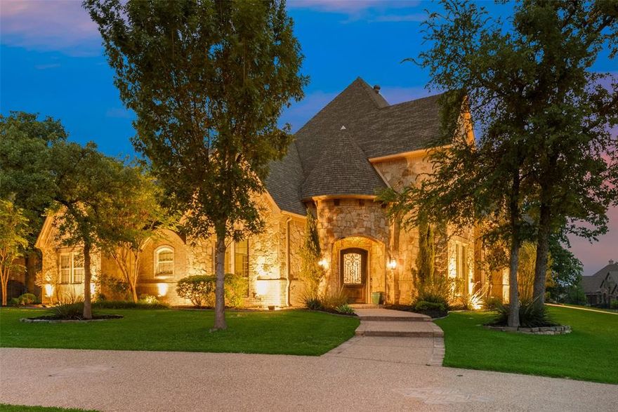 Stunning luxury home on a huge corner lot in the only 24-7 gated & guarded community on Eagle Mountain Lake, The Resort! Welcome to the exquisite 4 bedroom, 4 bathroom home nestled on a spacious corner lot. This beautifully designed residence features an open floor plan, room for the entire family, and a backyard you will never want to leave. The chef-inspired kitchen is complete with high-end appliances, including a built in refrigerator, gas cooktop, double ovens and opens seamlessly to an inviting living room with a stone fireplace, vaulted ceilings, and plenty of room for everyone to relax. The thoughtfully designed floor plan offers split bedrooms downstairs, including a luxurious primary suite with a wet bar, additional seating area, access to the backyard, spa-like bath and oversized closet. Upstairs you will find two additional bedrooms, two full baths, and a spacious game room that opens to a balcony overlooking the serene backyard and scenic 17th hole of the golf course. The game room also offers attic access with potential room for expansion if needed. The backyard is truly in a league of its own with multiple living areas, outdoor kitchen, fireplace, beautiful pool and spa with tanning ledge with loungers, in-pool seating area, and water features overlooking the beautiful built in TV to enjoy. Turf putting green completes the backyard surrounded by mature trees. The oversized garage provides ample space for vehicles, golf carts, boats, or any and all of your outdoor toys. This community includes an 18 hole golf course, private boat ramp,  dock, two pools, fitness center, basketball and tennis court, clubhouse restaurant and bar. Enjoy the elegance, peace, and serenity of Resort styled living while not sacrificing proximity!