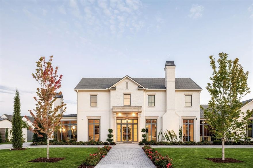 Located in the heart of Preston Hollow, 5610 Lobello Drive is a newly constructed Georgian-inspired estate by Pierce Jordan Development, blending timeless architecture with modern living. Set on a landscaped half-acre, the nearly 7,900 SqFt home offers refined design, classic proportions, and exceptional functionality. The residence features five bedrooms, six full baths, and two powder baths, with interiors finished in marble, limestone, and wide-plank wood flooring, complemented by custom cabinetry and hand-troweled plaster walls. The chef’s kitchen is equipped with Thermador appliances and marble countertops and opens seamlessly to gracious living and dining spaces. The primary suite serves as a private retreat with a coffee bar, marble floating tub, and expansive dressing room with an additional laundry closet. Additional spaces include a study, den, game room, and lounge with a bar. Outdoors, a 40-foot pool and spa, outdoor kitchen, and covered terrace accessed through an indoor loggia, create an ideal setting for entertaining and everyday enjoyment.