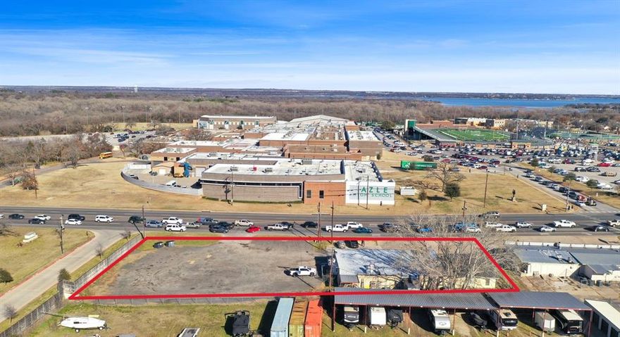 This land's prime location next to Reata Apartments, across from Azle High School, and  next to established neighborhoods offers tremendous potential for success. Directly on the north entrance of Azle on Farm to Market Road 730N, it offers exceptional visibility and access to a high volume of foot traffic creating an excellent customer base and ensuring long-term potential. This property is perfect for a variety of commercial uses, including retail, office space, or service-oriented businesses catering to the school community, apartment residents, and surrounding neighborhoods. This commercial parcel is situated in a thriving area, with easy access to major roads, making it an excellent location for businesses seeking to serve the local market. This is a rare opportunity to secure a valuable piece of commercial land in one of Azle's most promising locations. Whether you're an investor or a business owner, don’t miss out on the chance to be part of Azle's expanding commercial landscape.