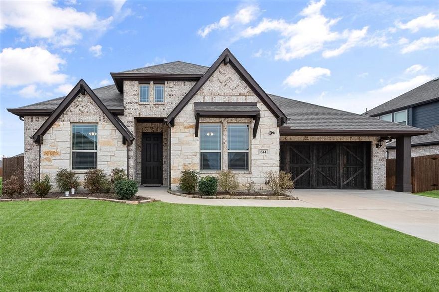 Why wait for new construction when this beautifully upgraded Caraway floorplan is move-in ready? Located in one of Waxahachie’s growing communities, this 4-bedroom, 3-bath home offers 2,458 square feet of functional living space designed with flexibility in mind. A private front bedroom with adjacent full bath is ideal for guests, multigenerational living, or a home office. The open-concept layout features wood flooring, a spacious kitchen with double ovens, and a primary suite with dual vanities, oversized shower with built-in seat, and custom laundry-to-closet pass-through. Enjoy the extended covered patio overlooking a flat .237-acre backyard with room to entertain, play, or add a future pool. Additional highlights include a full-home generator, plus refrigerator and mounted TVs can remain. Ask about available lender incentives.