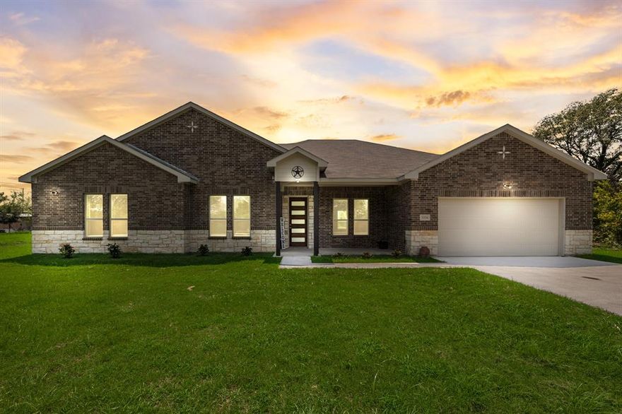 Welcome home to this brand-new 2024 custom build sitting on 1.52 acres in the peaceful countryside of Corsicana, Texas. This stunning 4-bedroom, 3.5-bath single-story home offers 2,860 sq ft of modern luxury with a wide-open floor plan designed for both comfort and style. The expansive 22x22 living room flows seamlessly into a chef-inspired kitchen featuring a large island, walk-in pantry, butler’s pantry, breakfast bar, and elegant built-in cabinetry—perfect for hosting and everyday living.
The primary suite includes a spa-like ensuite with separate shower and a generous walk-in closet. A second primary bedroom with its own private bath provides the ideal setup for guests, multigenerational living, or an in-law suite. Additional bedrooms feature walk-in closets, offering plenty of storage throughout.
Enjoy the durability and beauty of luxury vinyl plank flooring, a dedicated home office, and a spacious formal dining room. Step outside to your covered front and rear porches, ideal for relaxing and taking in your private acreage. The property includes a 2-car attached garage, ample driveway parking.
Located just minutes from town with the feel of quiet country living this home is ready for you to move in and start enjoying the perfect blend of space, privacy, and modern comfort. Don’t miss out schedule your tour today!