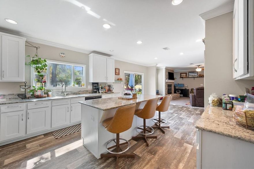 Welcome to this beautiful 4-bedroom, 3-bath home nestled on a full acre surrounded by tall, mature trees—offering both shade and privacy. Step inside to discover two spacious living areas and a cozy wood-burning fireplace that create the perfect atmosphere for comfort and connection.
The open-concept kitchen features stainless steel appliances, ample cabinetry, and a large island ideal for family meals or casual gatherings. A thoughtful split-bedroom layout provides privacy for everyone, while the utility room—complete with a sink and washer and dryer—adds everyday convenience. Out back, unwind or entertain on the expansive patio and deck, all while taking in the peaceful country views. Combining space, comfort, and unmistakable Texas charm, this home is truly the best of country living.