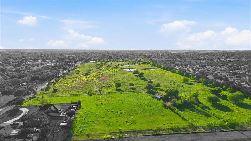 This 39.388-acre tract offers a rare opportunity for buyers seeking usable acreage in DFW with development potential. Zoned A-5 residential, the property is well-suited for a custom home, private ranch, family compound, or future residential development (subject to local approvals).
Utilities are available at the property line, providing a significant advantage for those looking to build or develop efficiently. The land features gently rolling terrain, offering multiple attractive build sites with natural elevation and drainage.
Unlike many raw land offerings, this property is already improved with cross fencing (on the east side), two rustic barns, and a loafing shed, making it immediately functional for livestock, recreation, or interim use while plans are finalized.
Three scenic ponds and a seasonal creek bed enhance both the aesthetic appeal and usability of the land—an increasingly rare feature that adds long-term value for both end users and investors.
Property includes 1601 and 1611 Oak Grove Rd E (2 addresses, 3 parcels)