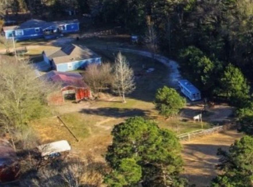 TUCKED AWAY IN TYLER TEXAS.. A TURN KEY EQUINE PROPERTY offering a beautiful updated 16X84 ranch style manufactured home that is meticulous maintained and containing four bed and two bath home sits awaiting a new family. The home is fully updated with granit counter tops, walk in closets,decorative lighting, a covered front porch and back deck. The acreage is fenced and cross fenced with multiple turnouts, a tack room for equine supplies and a storage building, a small barn area covered 4 horse stalls located behind the home. A loafing shed in front to the left of property. A large open arena , horse walker , round pens. another insulated barn with 6 horse stalls and outbuildings for storage. Property is surrounded by mature tall pine trees very secluded and hidden away and a long private road accessing the home from the main county road.
 THIS IS THE SECOND HOME ON THE SAME PROPERTY both homes can be used for large extended famlies, mother-in-law, or grand parents home. Great opportunity to extend your portfolio and use as investment properties such as rentals. This is a rare find with lots of options for investors or large familes. SEE MLS  21162924 FOR DETAILS ON  SECOND HOME ON PROPERTY.
