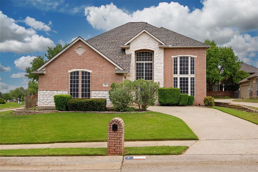 Highland Village show stopper on an oversized corner lot in a private cul de sac! Light and bright with enormous windows that flood every space with natural light. Wood-like tile throughout the first floor common areas is perfect for pets and not having to worry about scratches or dents in your wood floors. Upgraded carpet and pad in all the bedrooms and upstairs. Incredible space throughout the home means never feeling like you're on top of each other. Very large downstairs primary suite with huge windows and a newly remodeled spa-worthy primary bath! Seamless glass shower enclosure, quartz counters, designer black finishes and mirrors, and a soaking tub after long days! Primary closet has a ton of hanging space and room to move around. Formal living with two-story windows and formal dining with passage into the well appointed chef's kitchen. Gas cooktop, newly painted 42in cabinets with pulls, center island, stainless steel appliances, tons of counter prep space, and an eat-in breakfast nook. Spacious first floor living room with gas fireplace and two story windows letting in great natural light. Downstairs powder room convenient to all living spaces. Upstairs we find three more large bedrooms with ceiling fans, a full bath, and a great game room for fun or movie area. Oversized corner lot offers a phenomenal backyard entertaining area large enough to play catch or throw the tennis ball for you pups. Covered patio on the back door gives great space for entertaining and backyard BBQs. Feeding to exemplary primary and intermediate schools and Marcus High School. Conveniently located to shopping, schools, restaurants, and entertainment. Photos don't do it justice. Tour today!