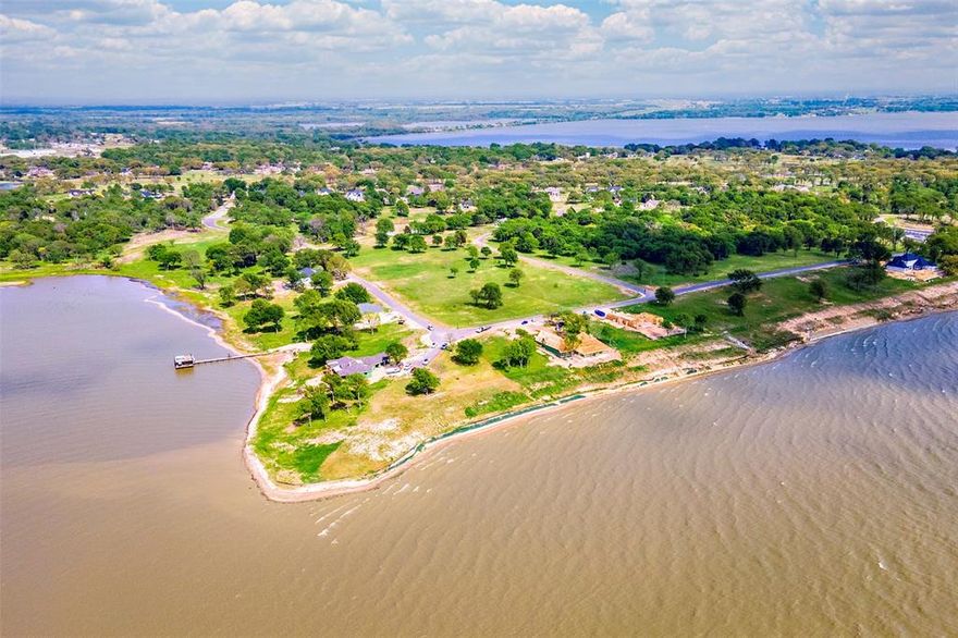 Gorgeous OPEN water lot to build your dream home on Cedar Creek Lake.  Cedar Creek Landing is a gated, upscale, newer subdivision on the northern part of the lake, which provides easy, quick access to Dallas and Fort Worth.  Imagine after a long day, within 45 mins, you are sitting, looking over the water and enjoying your favorite drink.  This community is fun for all.  Enjoy the community clubhouse, gym, infinity pool, grills, boat launch and dock, or walking through the tranquil streets.  This beautiful .6 acre parcel has a western, slightly southern orientation with 130' of shoreline.  Enjoy the cool breezes and watch gorgeous sunsets on your own slice of heaven.  Cedar Creek Landing is right next to Cedar Creek Country Club, which has an 18 hole golf course, tennis courts, fine dining and a comfortable lounge for meeting with friends.