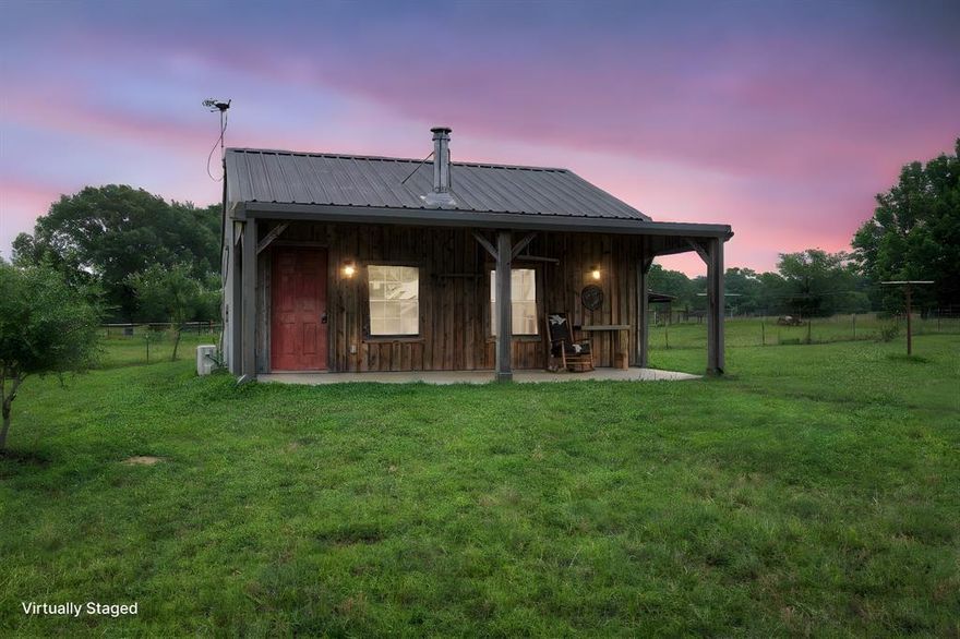 A perfect trifecta set up! Handcrafted custom cabin, 3 stall Barn and 30x40 Workshop on this sprawling 50.841-acre tract of scenic countryside in East Texas. This unique property offers an extraordinary opportunity for those seeking space, functionality, and serene natural beauty. Featuring a winding creek, tranquil ponds, sandy loam soil & multiple fenced pastures, this land has a variety of uses—from livestock and horses to recreation and future development. Patches of woods with mature trees are scattered throughout the property, offering shade, privacy, and a picturesque setting.
The land is thoughtfully improved with a large metal workshop equipped with two roll-up doors for easy access, a half-bath, and laundry facilities—perfect for projects, storage, or small business operations. A smaller barn sits nearby with an equipment storage overhang and several metal-rail-fenced pens, ready for animals, gardening, or expansion of your agricultural plans.
At the heart of the property is a cozy yet spacious cabin, ideal for weekend retreats, full-time living, or a guest home. The cabin features charming covered front and back porches where you can relax and take in the peaceful views. Step inside to an open floorplan that blends rustic warmth with practical comfort. Spacious living room is made comfortable by a mini-split for AC and heat, along with a wood-burning stove. Spray-foam insulation. The kitchen is both stylish and functional, with butcher block countertops, an island with a pot rack, and a small breakfast bar. A full bathroom includes a walk-in shower, vanity, and linen closet. A loft area provides additional sleeping or storage space.
Whether you're looking for a private ranch, a multi-use recreational property, or a quiet country escape with room to grow, this stunning 50+ acre parcel has the infrastructure, natural features, and charm to bring your vision to life. Plus 1000+ feet of county road frontage. 10 minutes from Winnsboro and Quitman.