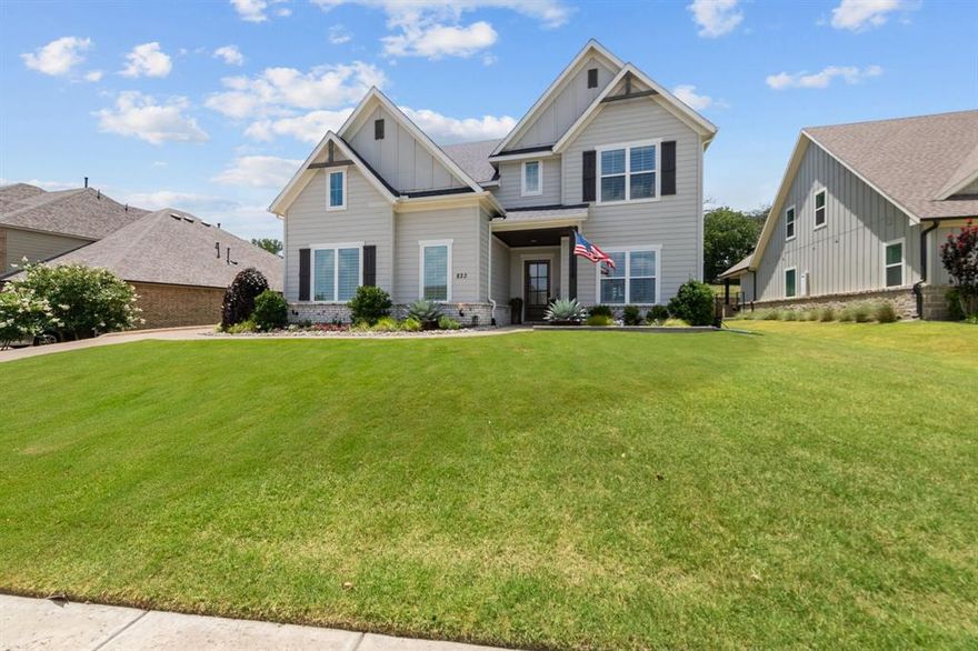 Welcome home to this well-appointed estate in sought-after 5T Ranch, where no detail has been overlooked. Upon stepping in, one quickly realizes there are custom touches throughout the home, from the upgraded kitchen to the resort-style backyard oasis.  Moving through the main floor is effortless because of the functional floor plan that flows from the grand two-story foyer to the main living, kitchen, and dining room. Once in the kitchen, the homeowner will enjoy Cafe appliances, an oversized counter-height island, large walk-in pantry, and decorative luxury lighting. From the kitchen, one can enjoy views of the dining room and main living area, with vaulted ceilings, a focal-point fireplace, and a wall of windows overlooking the outdoor living spaces. The primary suite is an escape with board-and-batten wall, views of the backyard, spa-like bath with rainfall shower, soaking tub, and custom closet. Other main floor highlights are a sophisticated study with built-in cabinets and a private guest suite with a walk-in closet. Continuing upstairs, a split staircase will take you to your secluded game room away from the hustle of the rest of the home, and on the other side, you will find two bedrooms with a Jack and Jill bath and walk-in closets. Outside, the designer touches continue with a covered patio featuring an outdoor kitchen with a built-in grill and fridge, which will please any grill master, as well as automatic screens and a large fan to cool off during those warm Texas summers. The backyard pool is the center of the fun, with a hot tub, tanning ledge, waterslide, and water feature all overlooking the community walking trail with large trees. This property has so many designer upgrades, it is a must see!