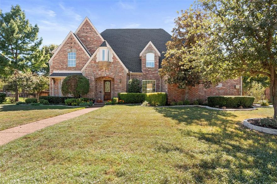 Welcome to 807 Cross Lane, a stunning 5 bedroom, 6 bath estate nestled at the end of a quiet cul-de-sac in the prestigious Foxborough community—walking distance to Southlake Town Square and zoned to Carroll ISD’s award-winning schools. A complete 2022 remodel transformed this home with refined transitional styling, high-end finishes, and thoughtfully designed spaces including new roof and whole house generator. The open floor plan showcases expansive living and dining areas, a fireplace-accented breakfast nook, and a spacious home office overlooking the backyard. Each of the five bedrooms offers its own private ensuite bath, all elegantly designed with spa-quality tilework, premium fixtures, and solid-surface vanities. The chef’s kitchen is a true showpiece—featuring two large center islands, two dishwashers, high-end stainless steel appliances, a walk-in pantry, and a separate mudroom that keeps daily living organized and functional. The primary suite and guest room are conveniently located on the main level, complemented by multiple living areas, dual staircases, and a study for relaxation. The utility room is designed for efficiency, offering two sets of stackable washer and dryers. Step outside to a private resort-style oasis—an oversized, fully turfed backyard with a custom putting green, sparkling pool, and covered pavilion with a full outdoor kitchen. The three-car garage adds ample parking and storage for today’s lifestyle. All four HVAC systems replaced in 2024. Combining modern luxury, quality craftsmanship, and unbeatable convenience, this Southlake masterpiece delivers a perfect blend of elegance and everyday comfort.