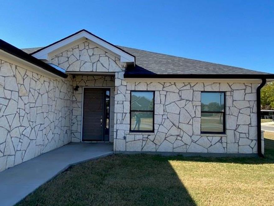 Beautiful Home in a Quiet, Desirable Neighborhood! Welcome to this stunning home located on a peaceful, clean street surrounded by new and newer homes, just minutes from the local school. You'll love the open concept floor plan with split bedrooms, perfect for both privacy and family living. The kitchen is a true highlight, featuring bright white cabinetry, granite countertops, a stylish tile backsplash, stainless steel appliances, and a bar with a double sink, ideal for casual meals or entertaining guests. The spacious master suite offers a coffered ceiling, a large walk-in closet, and a private bath with duel sinks and a walk-in shower. Two additional bedrooms share a well-appointed full bathroom between them. Step outside to enjoy the large covered back porch, accessible from both the living room and the master bedroom-perfect for morning coffee or evening relaxation. The backyard is fully enclosed with a wood privacy fence and includes an above-ground pool, which can stay or be removed at your preference. Sitting on a corner lot, this home combines modern style, comfort, and convenience in a fantastic neighborhood you'll be proud to call home.