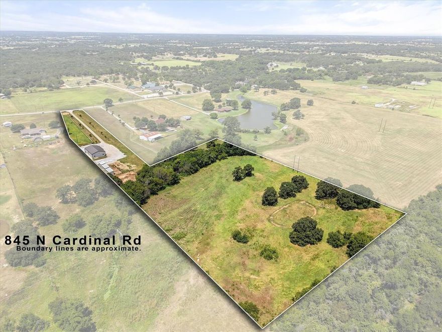 If wide-open skies, morning rides, and room for your horses sound like home, this 8.6 acre equestrian retreat delivers! Designed for both comfort and functionality, this unique three-bedroom, two-bath barndominium perfectly blends rustic charm with modern convenience. The thoughtfully designed home features a spacious upstairs loft with 2 large storage areas that is easily adaptable as a third bedroom or additional, flexible living space. Soaring ceilings create an open and airy atmosphere, and the wood and iron staircase is its own work of art. Custom cabinetry and finishes create a warm and inviting space. Enjoy morning coffee or evening sunsets from the wrap around porch, and connecting with family and friends gathered around the firepit.

The equestrian facilities include four stalls- each equipped with electricity and automatic water systems, ensuring ease of care and comfort for your horses or other animals.  Two large turnouts, measuring 2 and 5 acres, along with two 50x50 large pens provide ample space for exercise and grazing.

A 15'x15' tack room, covered storage for hay or equipment, and a 1400 sq ft shop with electricity cater to all your equestrian and maintenance needs. Additionally, an RV hookup offers convenience for RV storage, visiting guests, or additional living quarters. The cultivation of Coastal Hay yields approximately 30-40 large bales annually, adding to the property's efficiency and appeal.

With a total of 8.86 acres, adequate space remains for customization, allowing you to expand or tailor the property to your specific aspirations or those of your horses! Whether you envision a full-time residence, a weekend retreat, or an income-generating rental or boarding investment, this property offers many versatile opportunities.
Schedule a showing to see more of this rare find for horse enthusiasts, or those with an interest in 4H, or FFA seeking a peaceful country lifestyle.