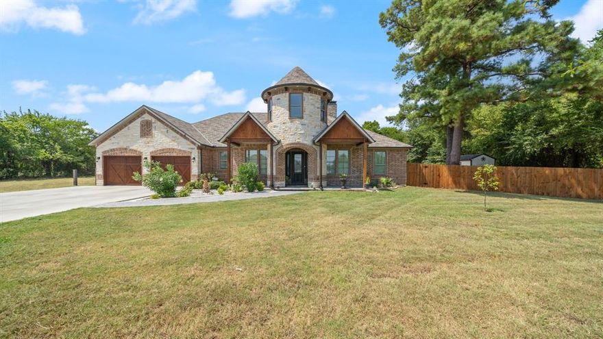 Welcome to this stunning custom-built home, offering nearly 4,000 sq. ft. of beautifully designed living space on a serene 1-acre lot—all just under 20 miles from downtown Dallas.
This spacious residence features 4 bedrooms, 3 full bathrooms, and a versatile upstairs bonus room, perfect for a study or extra storage. Soaring 10-foot ceilings enhance the open feel, while spray foam insulation in both attics and walls ensures energy efficiency.
The exterior exudes warmth and character with Cedar accents and Cedar garage doors, blending seamlessly with the landscaped surroundings. Built for durability, the home is topped with a 40-year Class 4, Impact-Resistant Roof, providing superior hail protection. A fenced yard with a private gate offers added security and privacy, creating the perfect retreat for relaxation and outdoor enjoyment.