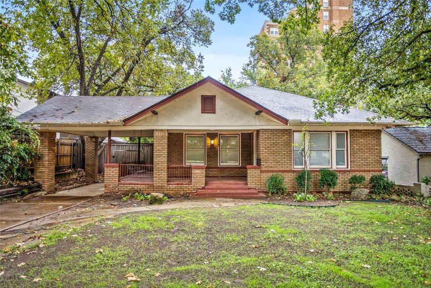 Step back in time with this inviting 3 bed one and a half bathe  home full of character and warmth! Located in one of Fort Worth’s most desirable areas, Mistletoe Heights, near the Fort Worth Zoo, Lily B. Clayton, TCU, and the vibrant cultural district, this 1924 Craftsman-style beauty offers timeless appeal and modern potential.
Inside, you’ll find original wood floors, large windows flooding each room with natural light, and a cozy living area with a classic brick fireplace. The kitchen showcases abundant wood cabinetry, a gas cooktop island, and built-in storage that adds to the home’s vintage charm.
Enjoy peaceful mornings or relaxing evenings on the wrap-around front porch, perfect for coffee or friendly gatherings. The spacious backyard features a decked patio ready for entertaining, mature shade trees, and a storage shed for all your tools or hobbies.
Additional highlights include a basement for extra storage or workspace, a long driveway with covered parking, and proximity to parks, restaurants, and entertainment. This home is a rare find offering old world craftsmanship with endless opportunities to make it your own in one of Fort Worth’s most iconic neighborhoods.