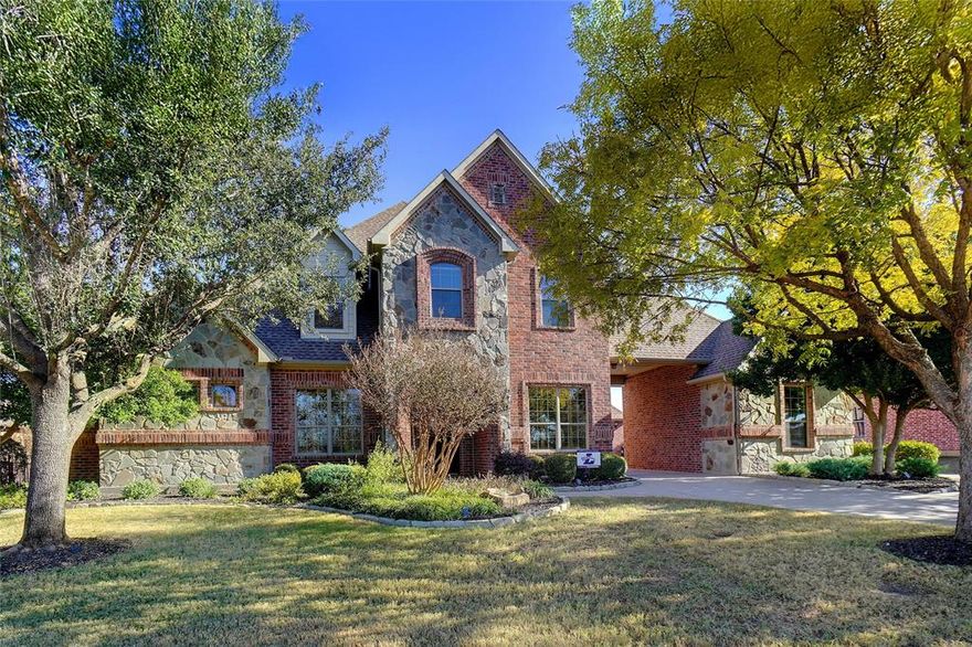 This home offers the rare combination of space, privacy, and lifestyle in a quiet Denton neighborhood backing to Denton Country Club and zoned to highly sought-after Argyle ISD. This beautifully maintained 4-bedroom, 4.5-bath home spans 3,530 sq ft and is designed for families ready to settle in and stay.
A timeless brick-and-stone exterior, mature trees, and inviting curb appeal set the tone. Inside, rich hardwood floors, custom trim, and thoughtful architectural details create a warm, elevated feel. The open kitchen is the heart of the home, featuring an oversized island, quartz countertops, custom cabinetry, and seamless flow into the main living area—ideal for everyday living and entertaining.
The spacious primary suite is a true retreat with a spa-inspired bath, dual vanities, soaking tub, and large walk-in closet. Secondary bedrooms offer excellent space and bathroom access, providing comfort and privacy for family and guests. Multiple living areas allow flexibility for a home office, game room, or media space.
Step outside to your private backyard oasis with a resort-style pool, covered outdoor living area, and built-in bar—perfect for weekend gatherings or quiet evenings at home. Backing to the country club creates a peaceful, open setting rarely found.
A three-car garage, including a separate single-car building, adds exceptional functionality for storage, hobbies, or a golf cart. Conveniently located near Denton and Argyle, this home delivers long-term value, top-tier schools, and a lifestyle buyers are searching for.