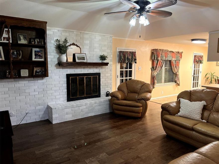 New Roof installed December 16th which is big savings on insurance.   Start 2026 in your new home!   This beautifully maintained home offers exceptional curb appeal with a welcoming front porch and a large, gated side driveway. Inside, you’ll find a bright and open layout featuring 4 spacious bedrooms and 2 full bathrooms. The living area includes a cozy gas fireplace and flows seamlessly into the kitchen and breakfast nook, creating an ideal space for family gatherings and entertaining.  The home features newer windows and flooring, no popcorn ceilings, and plenty of natural light throughout. The dining room—currently used as an office—provides flexible living options to suit your needs. Three of the four bedrooms include walk-in closets, and the oversized laundry room provides additional convenience and storage space.  Step outside to enjoy the expansive backyard, perfect for outdoor entertaining, recreation, or future additions. With ample parking, a large lot, and thoughtful updates, this property offers both comfort and functionality.  This home is perfect for anyone looking for space to grow in a welcoming, move-in-ready property.