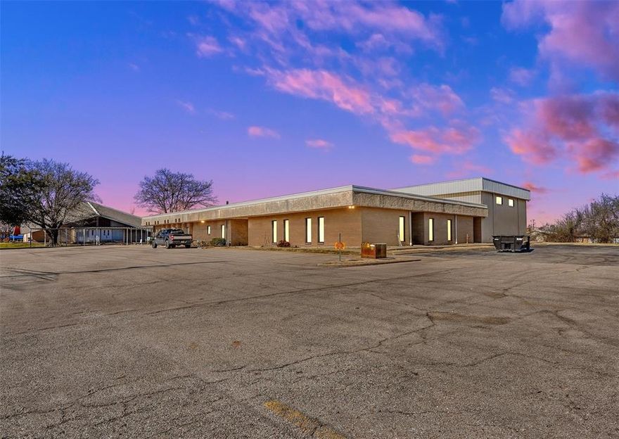 This ±8,650 square-foot office-flex space is available for lease in the heart of Greenville, TX. The property offers a versatile layout, with the option to subdivide into a minimum of ±250 square-feet. Formerly a church, the building features a gymnasium with a 19-foot clear height, which can be converted into a warehouse. Additionally, there is potential to add gravel at the rear of the property and install a grade-level door, subject to negotiation. The space includes primarily private offices, a large full kitchen, four restrooms, and ample on-site parking. This property presents a prime opportunity for a wide range of uses, including daycare, religious services, professional offices, medical facilities, and more. Conveniently located just off Wesley Street, one of Greenville’s main thoroughfares, the property benefits from high visibility and traffic, with over 25,000 vehicles per day in the surrounding area.