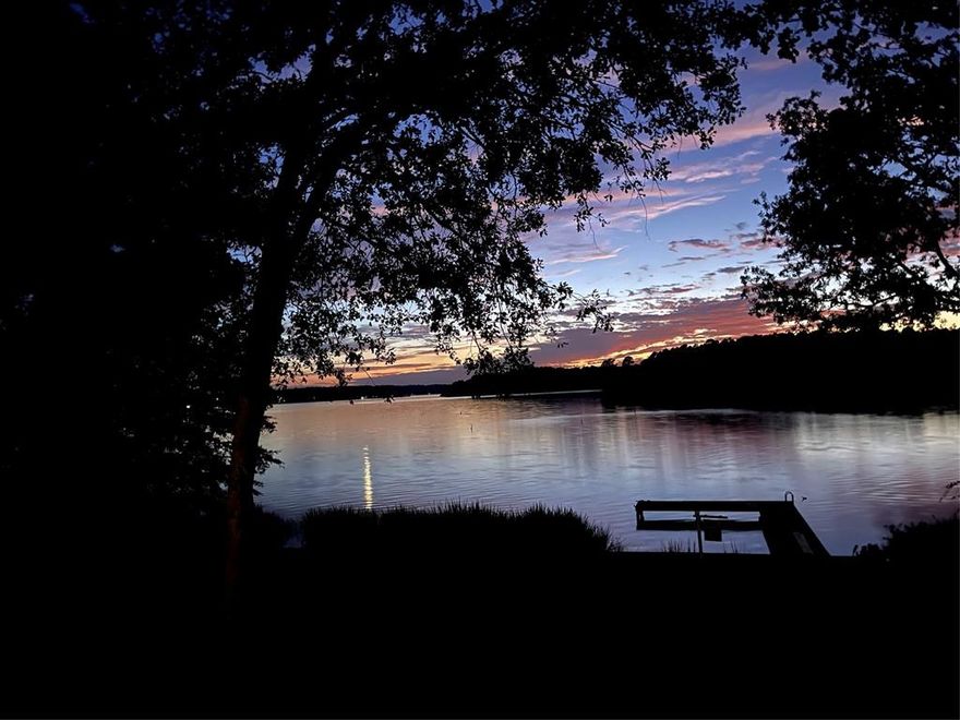 GORGEOUS WATERFRONT VIEWS!!! BEAUTIFUL SUNSETS!!!! LAKE HOUSE on HOUSTON COUNTY LAKE!! Nestled in the pines of East Texas! Welcome to the Gorgeous Sunset House! Your lakefront retreat on beautiful Houston County Lake awaits you. This well-maintained property offers the ideal combination of comfort, updates, and outdoor enjoyment, situated on a 0.54-acre waterfront lot with a pier and bulkhead in place.
Featuring updates throughout, an open concept, 2 bedrooms, 2 full bathrooms. The front porch overlooks the lake and provides a serene, elevated “treehouse” view — perfect for enjoying morning coffee or evening sunsets over the water. This home has undergone numerous recent updates, ensuring peace of mind and move-in readiness: New Tankless Water Heater, New luxury vinyl plank flooring, New white kitchen cabinets, New butcher block countertops, New AC condenser, New roof, New carport, Concrete driveway with additional concrete pad for parking, New pier boards, Ample covered storage for outdoor lake toys, life vests, etc. The property’s waterfront setting, combined with recent improvements, makes this a wonderful option for a primary residence, weekend getaway, or investment property. With gorgeous views, peaceful surroundings, and direct access to Houston County Lake, this home is ready for its next owner to enjoy all that lake life has to offer. You have to see these views and this charming lake house for yourself!