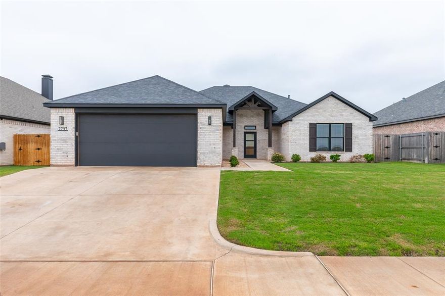 Oh, my goodness! Check out this Stunning and Spacious property, built by Dwell Homes, located in the Harvest, a south Abilene Premier Subdivision! This 2,650 SF property has 4 bedrooms, 3 bathrooms and a well sized bonus room! The perfect place for a play room, movie room, or home office option! The open layout is both functional and elegant with beautiful LVP flooring, an abundance of natural light, a wood burning fireplace, and a vaulted ceiling accented with a rich wood beam. Meal prep is easy in the well equipped kitchen. Here you will appreciate stainless steel appliances, a corner pantry, an island, and classy leathered granite countertops. There is also a coffee nook to get your day started on the right foot! The thoughtful layout of bedrooms and bathrooms creates both privacy and convenience for everyone, and the primary suite is absolutely spa like. Features include a soaking tub, a beautifully tiled walk in shower, double sinks, and an amazing walk in closest with built in drawers and shelving. Absolutely peaceful! The landscaped yard is enclosed with a wooden privacy fence and a covered patio provides a nice place to grill or chill this summer! Need a little relaxation and socialization? Take the short trip to the community pool and make a splash with your neighbors! This home is the whole package and then some! Come check it out!