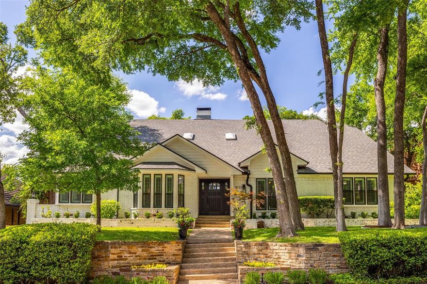 Located in the Lake Highlands area, this spacious home offers over 4,000 square feet with 4 bedrooms and 3 baths on a desirable tree-lined street. Mature trees and strong drive up appeal create a welcoming first impression. Inside, the thoughtfully designed layout features three flexible living areas with handscraped hardwood floors and generously sized rooms that provide space for everyday living and entertaining. The kitchen is designed for functionality and gatherings, featuring an oversized island, GE Profile double ovens, beautiful cabinetry, and an open flow to the large family room and adjacent den or gameroom. The private primary suite includes two large walk-in closets, dual vanities, built-ins, and abundant storage. The backyard offers a shaded setting with mature trees and a waterfall pool that creates an inviting outdoor space for relaxing or entertaining. Additional features include an electric driveway gate, gated side yard, and oversized two car garage with built-in storage and workbench. Conveniently located near major freeways, hospitals, shopping, and dining.