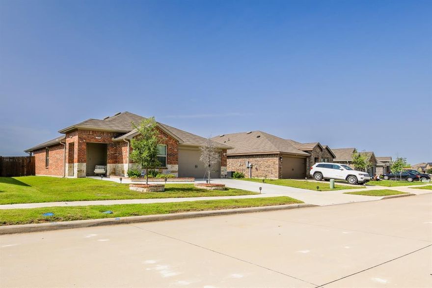 This beautifully updated 3-bedroom, 2-bathroom home offers 1,535 square feet of thoughtfully designed living space—perfect for families, first-time buyers, or anyone seeking comfort and modern style. Step inside to a spacious, light-filled open-concept layout, highlighted by an extra-large living area that's perfect for relaxing or entertaining. The kitchen and bathrooms feature luxury quartz countertops, sleek fixtures, and elegant lighting, creating a warm, modern aesthetic. Ceiling fans in the living room, all bedrooms, and the back porch provide year-round comfort. Each bedroom is generously sized and inviting, while the primary suite boasts his-and-hers closets and a spa-inspired en-suite bath for your private retreat. Outside, the custom-designed front yard adds instant curb appeal with charming brickwork surrounding the trees and flower beds. The fully fenced backyard is ideal for entertaining, gardening, or relaxing under the stars. Thoughtful upgrades like full gutters add both function and peace of mind. Located in a peaceful, sought-after neighborhood, you’ll enjoy a strong sense of community with easy access to local shops, schools, and major highways.