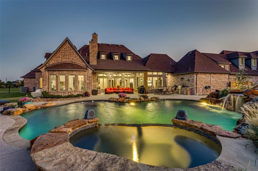 Stately and Grand with unmatched curb appeal in sought after Lucas, TX. From it's sprawling estate-style layout, to it's intricate roof lines and architecture, this home truly captures the eye. Be the envy of your friends with not only a 5 car garage, but also an over 700 sqft RV garage! Each garage is set for the toy enthusiast in mind. Epoxy floors and all. Endless amount of parking and play space with motor court. Sitting on 2 full acres in the award winning Lovejoy ISD, this home offers room to breathe. Take in the gorgeous TX sunsets from the XL back patio overlooking the sparkling pool. Don't miss all the custom touches in this home. Barrel ceiling entry, handsome wood beamed accented ceiling in the living & kitchen, harlequin style design ceiling down the hall and the amazing cathedral like ceiling in the master bath. Entertain with ease in the oversized chef's kitchen complete with butler's pantry and wine rm. Designed with comfortable luxury in mind.