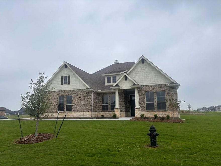 Estimated March 2026 completion! Ask about our Trade In Trade Up program, we can buy your home! The Verbena floor plan features a modern, open-concept layout and the sought-after features today’s homeowners are searching for. With four bedrooms, three bathrooms, and a flex room, this plan boasts just over 2,400 square feet of functional living space. Upon entering the home off the front porch, you’re welcomed by an inviting foyer. Immediately to the left is a hallway with a bedroom, walk-in closet and full bathroom, as well as a linen closet. Across the foyer is a flex room, perfect for a home office, formal dining room or whatever need your family has for the space. Past the foyer is the family entry, with storage space and mud bench, which leads to the laundry room and two or three car attached garage. Through the entrance, the home opens up to a large family room with a stately fireplace. Adjacent to the family room is a gourmet kitchen, equipped with a walk-in pantry, ample counter space and an oversized island. Finishing off this open-concept living area is a dining space which overlooks the covered back patio. The remainder of this one-story floor plan is just off the living space. A hall leads to two bedrooms with walk-in closets, another linen closet and a shared full bathroom. The back corner of the home offers privacy for the owner’s suite, featuring a massive walk-in closet and bathroom with a dual-sink vanity, standalone soaking tub and glass-enclosed shower.