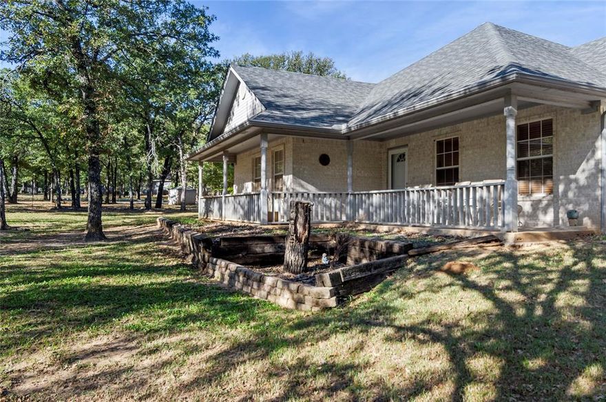 WAITING FOR THE PERFECT RURAL PROPERTY IN LITERAL PARADISE TEXAS ON A SMALL ACREAGE FOOTPRINT? Look no further! This well-kept home is nestled amidst many mature oak trees on a gated parcel is in sought-after Paradise, Texas and A-Rated Paradise ISD. Located in a mature, established neighborhood, this multi-acre, private tract features a lovely, secluded home with pasture areas front and back, porch and deck areas on 3 sides and a workshop with electric for all the hobbies! Fenced and cross-fenced with no known restrictions, Horses and other livestock or farm animals allowed. Home business or homeschool? No problem! Want to add a pool or park your boat or RV? Do it! Easy access to Decatur or Bridgeport? Check! This home shows beautifully and features warm hardwoods, an open floorplan, large kitchen with a double oven, microwave & dishwasher amidst an abundance of cabinet & counter space, next to the dining area, complete with a breakfast bar. You will love the cozy, central brick fireplace & hearth, large Primary Bedroom with ensuite bath featuring dual sinks & separate shower as well as his and hers closet space. Split bedrooms share a jack & jill bath and so much more! Oversized laundry and garage spaces-even with a golf-cart door! Tons of storage on this property. 2 inch blinds in all windows and a beautiful front glass storm door. Furnishings can also be purchased with or without the property. Roof is recent and home is immaculate! Don't let this one get away!