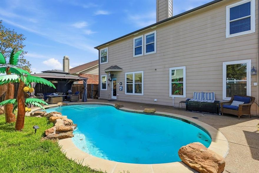 Welcome to your backyard oasis complete with crystal clear pool, decorative palm trees and a cabana! When was the last time you found a backyard oasis below $475,000?  This is a must see!
This beautifully maintained home offers the perfect blend of functionality and style, featuring an inviting open-concept layout ideal for both everyday living and entertaining. Natural light fills the living spaces, creating a warm and welcoming atmosphere from the moment you walk in.
The kitchen is a true centerpiece, complete with ample counter space, modern appliances and a seamless flow into the dining and living areas-perfect for hosting gatherings or enjoying quiet nights at home. The spacious primary suite provides a relaxing retreat, while additional bedrooms offer flexibility for family, guests or home office.
Step outside and fall in love with your own resort-style backyard featuring a sparkling pool with a stunning waterfall feature-the perfect setting for relaxing evenings, weekend gatherings or cooling off during those Texas summers. This outdoor space truly sets the home apart!
Ideally located with easy access to major highways, commuting to Dallas or Fort Worth is quick and convenient. You'll also enjoy being close to shopping, dining, parks and entertainment.
 Key features include: triple pane windows, French drains, updated light fixtures and energy efficient fans!
If you've been searching for a home that combines comfort, style and an incredible outdoor lifestyle-this is the one. Don't miss your chance to make it yours!