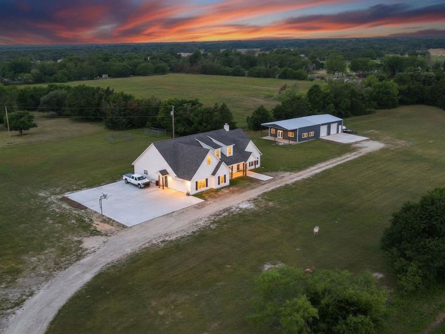 Beautiful country home on approximately 9.5 acres located in desirable Wills Point ISD. Property features a gated entrance, pond, and large shop with workspace and entertainment area with full bath. The well-designed split-bedroom floor plan offers an open living and kitchen area with vaulted ceilings, wood flooring, and plenty of natural light. Spacious primary suite includes dual vanities and walk-in his and her closets. Enjoy peaceful country views from the covered porch and mature shade trees throughout the property. Conveniently located near Hwy 80 for easy access to town. Perfect setup for a small ranch, home business, or anyone seeking quiet country living with modern comfort. Shop Building is 35x60 with additional 10x35 covered porch.