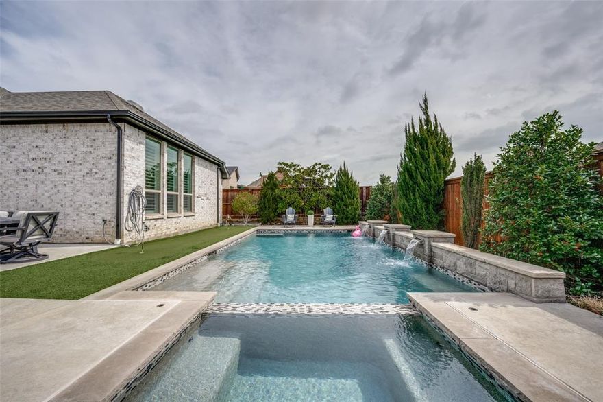 Step into refined ONE-STORY living in this beautifully upgraded single story home designed for both everyday comfort and exceptional entertaining. Featuring plantation shutters throughout and wide-plank wood flooring across the main living areas, this expansive open-concept layout seamlessly connects the kitchen, dining, and living spaces. The high-impact designer kitchen is a true showpiece, boasting white flat-panel cabinetry, Level 2 Silestone countertops, a striking apron-front Kohler sink set in the oversized island, stainless steel appliances, double ovens, and a 5-burner gas cooktop. An upgraded backsplash adds the perfect finishing touch, making this space as functional as it is stylish. The extended primary suite offers a private retreat with plush upgraded carpet and a luxurious bath featuring white cabinetry and premium finishes. A dedicated study provides an ideal work-from-home space, while thoughtful upgrades continue throughout the home with enhanced tile selections and upgraded carpeting in secondary bedrooms. Step outside to your own backyard oasis. Mature, tall trees create a serene backdrop for the saltwater pool, putting green, and fully equipped outdoor living area complete with a fireplace, outdoor kitchen, and pergola — perfect for hosting year-round gatherings. Additional highlights include: 2024 roof Tankless water heater, a 3-Car Garage with epoxy flooring and overhead storage, Bonus outdoor planters in the front yard to remain, and  2018 washer & dryer and 2020 refrigerator included. Lantana residents enjoy access to top-
rated schools, scenic walking trails, resort-style pools, new pickleball courts, amenity centers, and more. 805 Haverford Lane is a meticulously maintained home that combines luxury finishes, practical upgrades, and resort-style outdoor amenities. Don’t miss this rare opportunity to enjoy elevated living both inside and out.