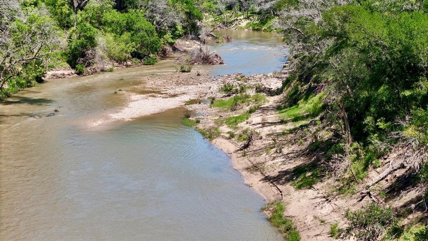 30-Acre Riverfront Ranch Opportunity – Bosque County, Texas

Nestled along the pristine Bosque River just outside Valley Mills in Bosque County sits this rare 30-acre ranch property that checks every box for serious ranchers, farmers, and outdoor enthusiasts. With direct frontage on one of Texas’ most beautiful rivers known for its crystal-clear water and limestone bottom, this is true river property that is exceptionally hard to find.

The land features gently sloping terrain with rich sandy loam soil, making it ideal for pasture improvement, hay production, or small-scale farming. Mature, scattered large oak trees provide natural shade, windbreaks, and timeless Texas character while creating picture perfect homesites or livestock loafing areas. Because the property sits on the higher side of the river, the flood plain is minimal, giving you greater peace of mind and more usable acreage year round.

Wildlife is abundant. Walk the ranch any morning or evening and you’ll encounter whitetail deer, Rio Grande turkey, and dove making this a hunter’s dream in addition to a working ranch. Water and electricity are already available to the property, so you can start building, fencing, or running livestock immediately.

For those who want to expand, an additional 30 acres is also available for purchase, giving you the option to grow your operation to a full 60-acre riverfront ranch.

Whether you’re looking to run cattle, raise horses, start a small farm, or simply own a private slice of Texas river paradise, this 30-acre gem delivers the perfect blend of productivity, recreation, and natural beauty. Rare river ranches like this do not last long.

Ready to make it yours? Contact us today to schedule a private tour and see why this Bosque River property is the one you’ve been waiting for.